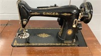 Singer Sewing Machine in cabinet with lift top