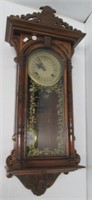 Wall clock. Measures: 26 1/2" H x 13 1/2" W.