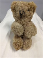 Small jointed stuffed teddy bear