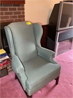GREEN UPHOLSTERED WING BACK ARM CHAIR