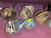GROUP OF 7 WICKER BASKETS WITH STUFFED PILLOWS