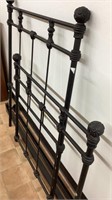 Twin bed frame, black painted metal, has side