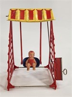 VINTAGE PLASTIC WIND UP SWING CHAIR W/ BABY