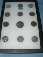 Kennedy half dollar coins and an Eisenhower dollar