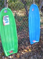 Pair of hard plastic Lightening Brand toy sleds