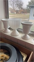 Three white glass vases
