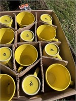 Box of yellow mugs