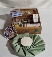 Corina cigar box of medical supplies