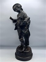 Flawed G. Doupre A bronze figure of a boy writing