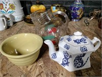 Porcelain bowl porcelain teapot and a glass