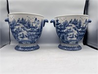 2 blue and white planters