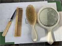 Hand mirror, hair bush and comb