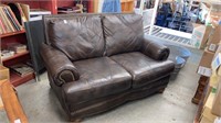 Brown leather style loveseat 68’’L