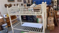 Metal bunk beds cream-painted