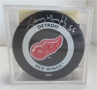 Signed Detroit Red Wing hockey puck.