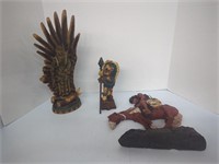 3 native American figurines, the one with feather