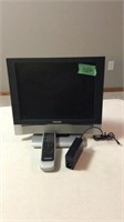 Magnavox 15” tv with remote. Missing part of