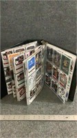 Various trading cards and binder