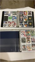 Various football trading cards in binder
