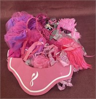 Assorted dress up items and Breast can awareness
