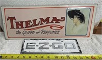 Vintage Thelma perfumes & E Z Go signs