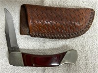 Retro locking blade knife in sheath