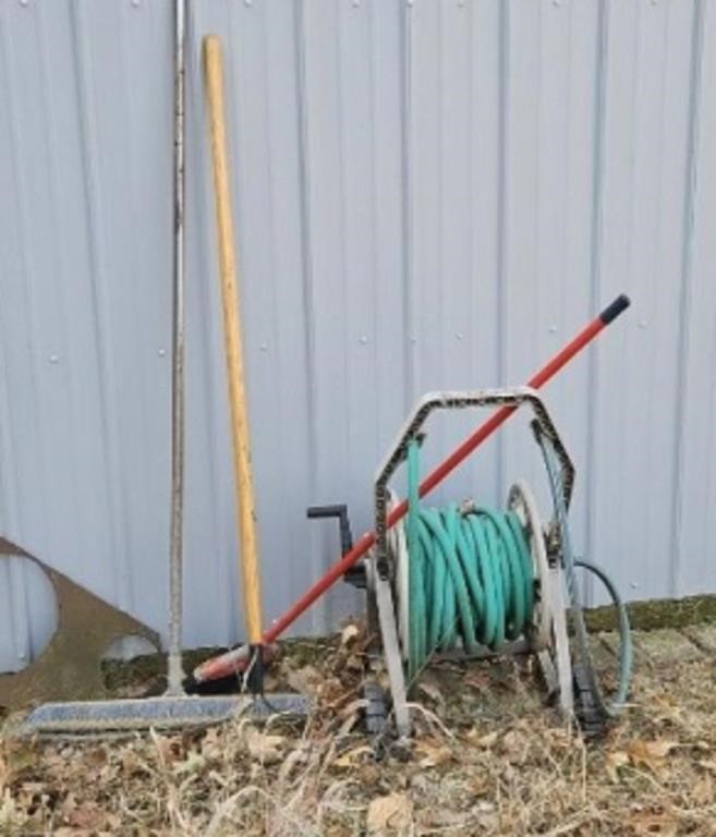 Hose and wheel, rake, brooms