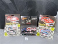 Nascar lot, with 3 different cars