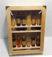 Pennzoil salesman's sample, oil jars in cabinet