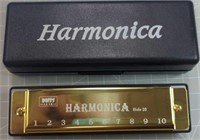 New harmonica with case