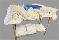 Large lot of white table covers and skirts along