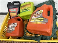 Lot containing bar oil, antifreeze, drop cord and
