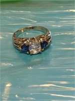 Size 7 cubic zirconia stone with side sapphire