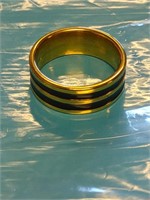 Size 9 gold colored band with black accent