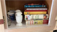 Shelf lot of cook books, salt and pepper shakers,