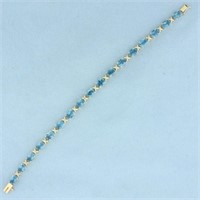 Swiss Blue Topaz and Diamond Tennis Bracelet in 14