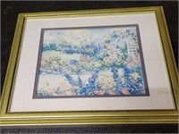Meadow of flowers in gold frame