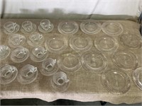 12 clear glass salad plates, cups and saucers.