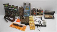 Various hunting items including grunt call, camo