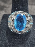Silver In Color Ring With Blue Stones