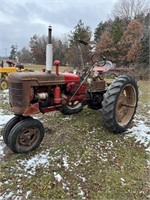 Farmall C with mounted sickle mower runs drives