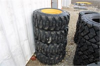 4 Unused 12-16.5 Skid Steer Tires on Yellow Wheels