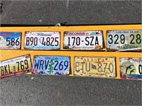14 Retro Metal license plates on a wood board