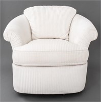 Kagan Style Cream Upholstered Swivel Armchair