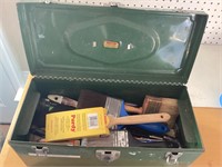Metal tool box with paintbrushes