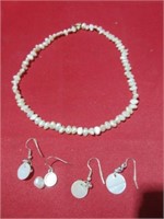 necklace and earrings .