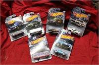 Six Hot Wheels and package