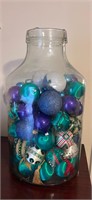 Vintage side footed glass jug w ornaments