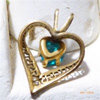 Heart gold pendant with aquamarine stone