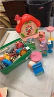Lot of kids toys. Strawberry shortcake clock and